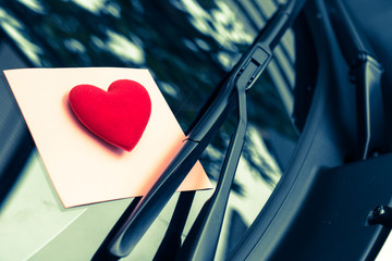 love letter heart on a sticky note under a windshield .vintage  color style