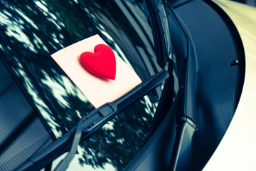 love letter heart on a sticky note under a windshield .vintage  color style