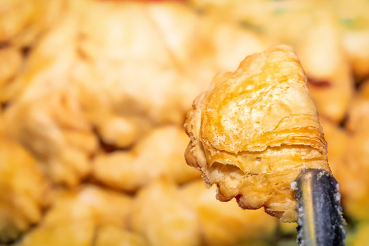 Traditional Asian Freshly Fried Puff Pastries In A Street Vending Tray. Close-up