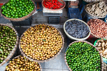 tropical spices and fruits sold at a local market in Hanoi (Vietnam)