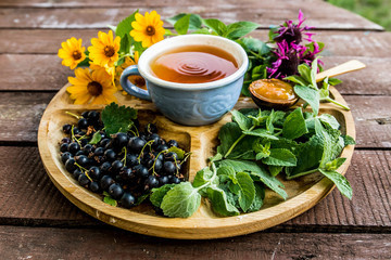 cup tea herb echinacea mint chamomile berry plant blueberry flavor aroma jam apricot sweetness dessert tea drinking traditional useful menu menus wooden ingredients