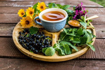 cup tea herb echinacea mint chamomile berry plant blueberry flavor aroma jam apricot sweetness dessert tea drinking traditional useful menu menus wooden ingredients