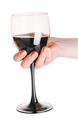 glass of red wine  in female hand