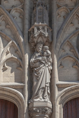 City Ghent. Cityscape. Sculpture above the entrance to the Cathedral of Saint Bovon