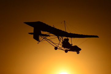 Ultralight airplane at sunset.