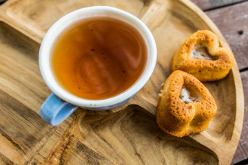 Cup of tea blue tree wooden cake biscuit dessert sweetness tea tea nature flavor flavor
