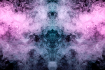 Obraz na płótnie Canvas A multi-colored pattern of purple and blue smoke of a mystical shape in the form of a ghost's head or a strange creature on a black isolated background. Abstract pattern in of waves and steam.