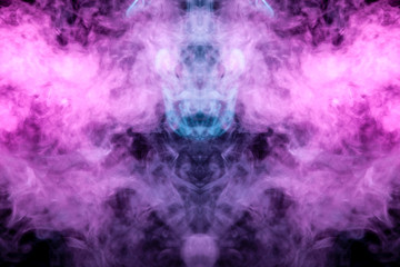 A multi-colored pattern of purple and blue smoke of a mystical shape in the form of a ghost's head or a strange creature on a black isolated background. Abstract pattern in of waves and steam.