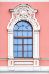 Window on pink wall.
