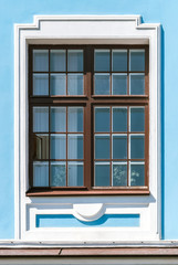 Window on the blue wall.