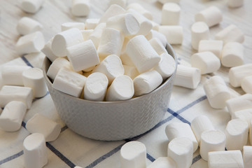 Sweet white marshmallows in a bowl, low angle view. Close-up.