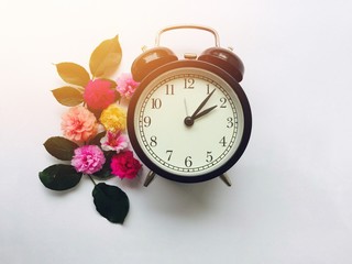 vintage alarm clock and flowers