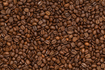 Coffee Beans Background. Roasted coffee beans close up.