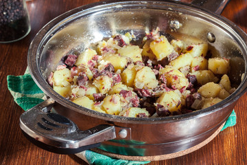 Corned beef hash in a frying pan