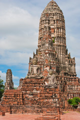 An old temple built of brown brick is a beautiful architecture with sky and clouds.