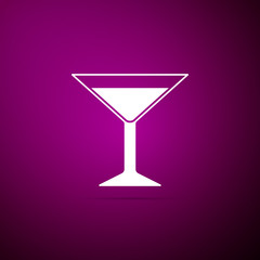 Martini glass icon isolated on purple background. Cocktail icon. Wine glass icon. Flat design. Vector Illustration