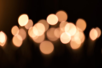 Fototapeta premium Yellow abstract bokeh background. Blur light bokeh