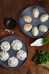 traditional Georgian khinkali and Uzbek manti with meat