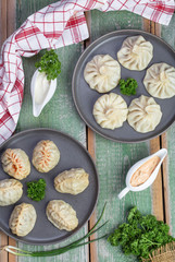 traditional Georgian khinkali and Uzbek manti with meat