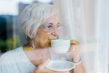 Senior women having Fresh coffee at the morning