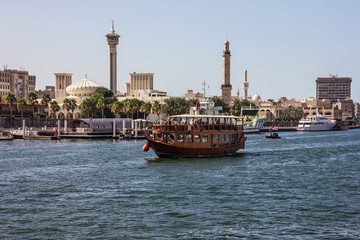 Dubai, UAE: Tourist boat abra on canal of Dubai Creek old tow