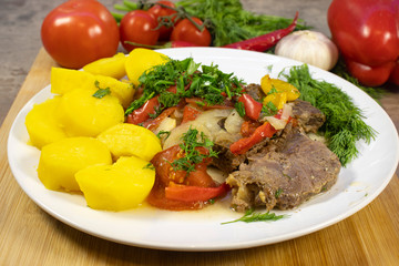 Potatoes, stewed meat with vegetables