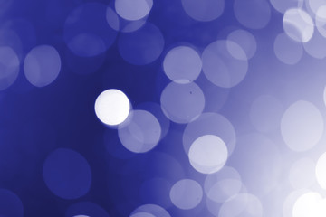 White bokeh on a blue background