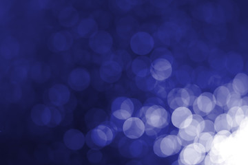 White bokeh on a blue background
