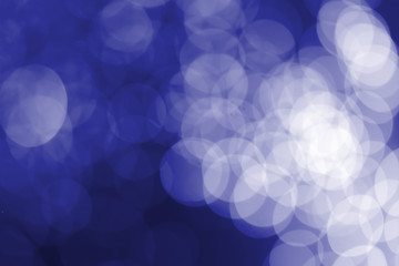 White bokeh on a blue background