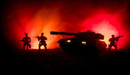 War Concept. Military silhouettes fighting scene on war fog sky background, World War German Tanks Silhouettes Below Cloudy Skyline At night. Attack scene. Armored vehicles. Tanks battle