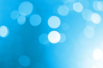 White bokeh on a blue background