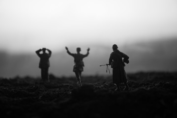 War Concept. Military silhouettes fighting scene on war fog sky background, World War Soldiers...