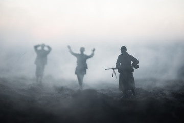Fototapeta na wymiar War Concept. Military silhouettes fighting scene on war fog sky background, World War Soldiers Silhouettes Below Cloudy Skyline At night. Attack scene. Armored vehicles. Tanks battle. Decoration