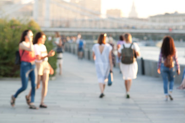 people walking along the city's quay