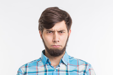 Obraz premium People, gesture and emotions concept - Sad or angry bearded man on white background