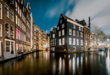 Fototapeta na wymiar Amsterdam, canals and buildings at dusk