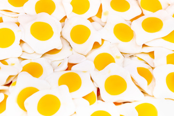 Fried Eggs Close-up Background, Texture. Jelly Candies Like Fried Eggs. Soft Focus.