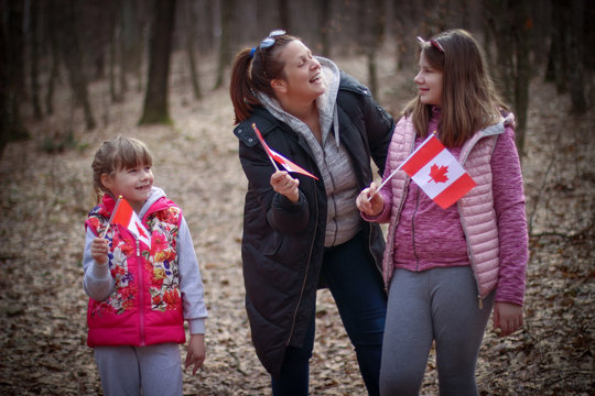 Happy Family With Flag Of Canada