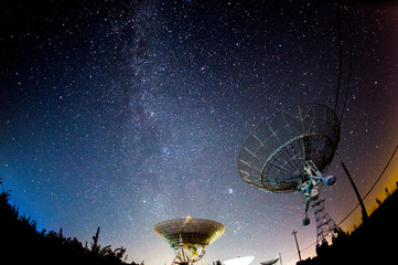 Radio telescopes and the Milky Way at night