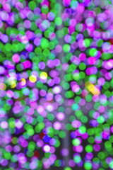 defocused Christmas lights on soft colors tone 