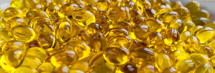 yellow capsules pills close-up. top view