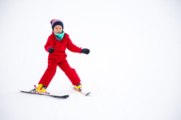 Little girl training skiing