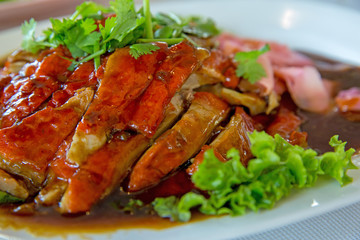 Chinese Roasted duck served on white plate