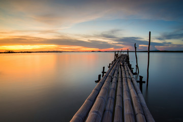 Fototapeta premium Bamboo bridge in the sea the twilight