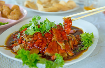 Chinese Roasted duck served on white plate