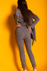 beautiful woman wearing a gray suit with a stylish women's jackets and pants. Conception of...