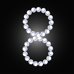 Pearl necklace figure eight on a dark background.