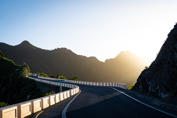 road into the mountains at sunrise