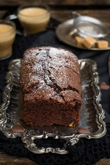 Homemade sweet cholocate cake with powdered sugar