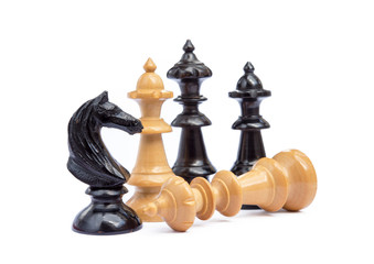 Old chess pieces isolated on white background